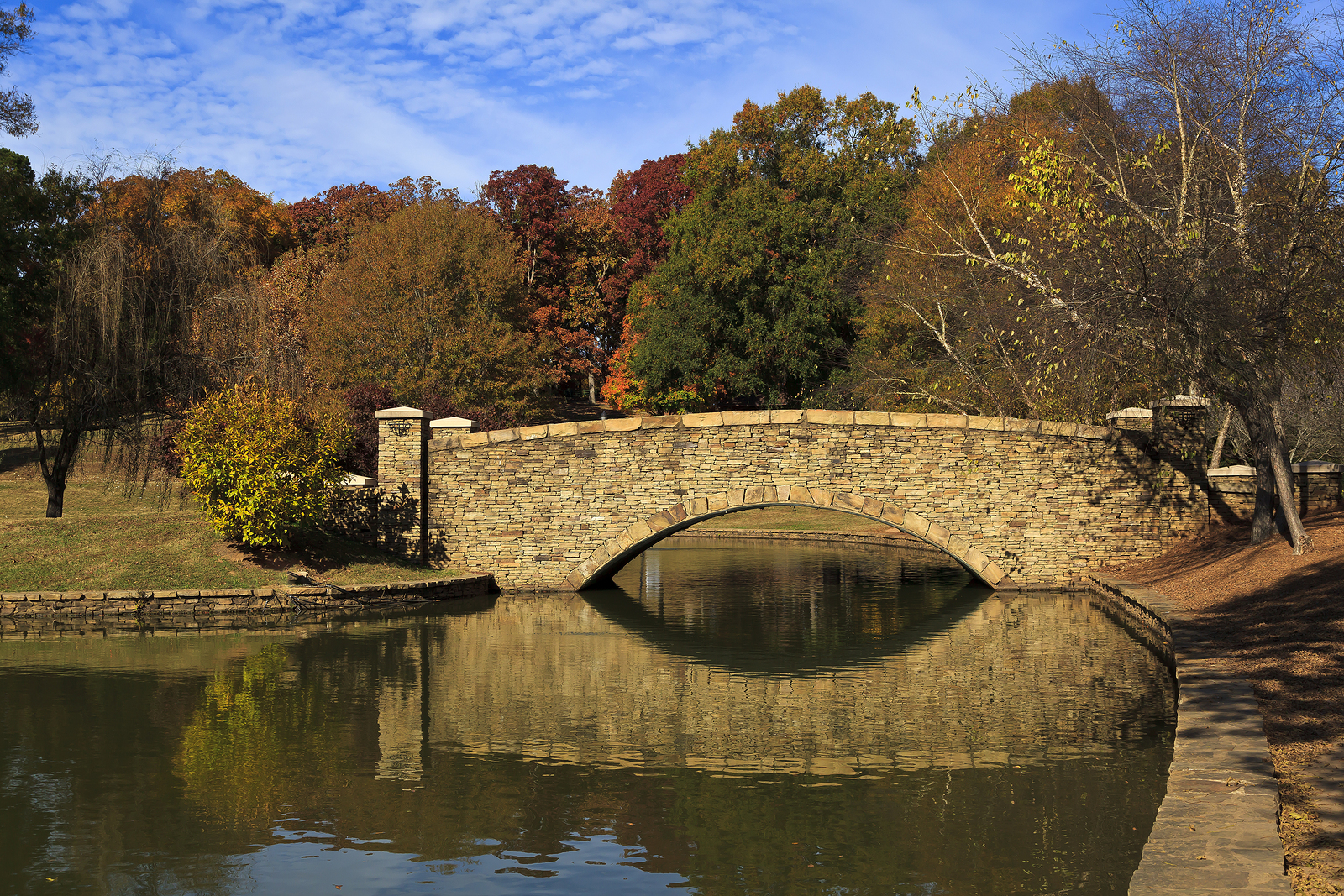 The stone bridge at Freedom Park in Charlotte, NC in the fall season